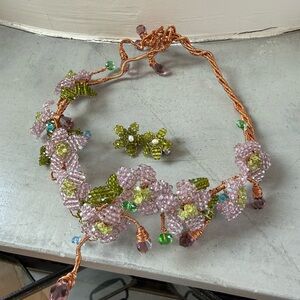 Elegant Beaded Floral Necklace with Copper Accents and earrings